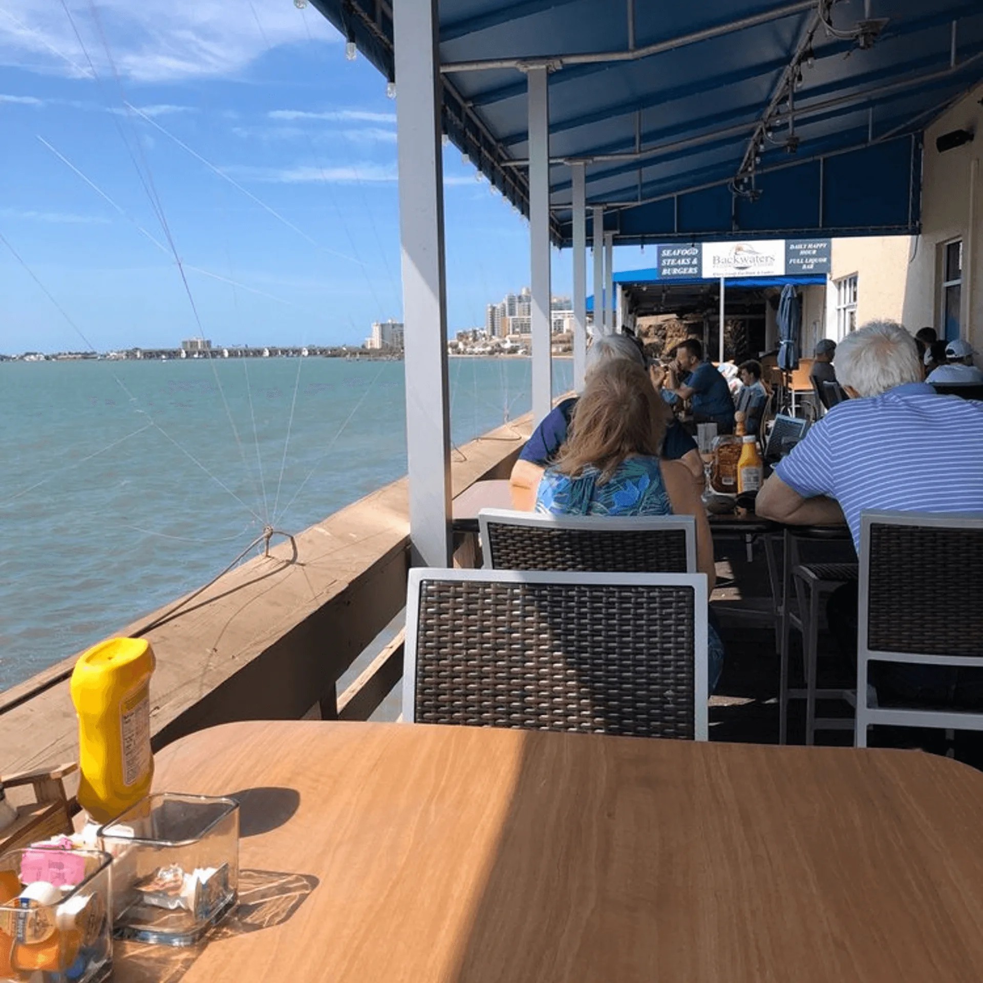 Guests dining on Shorty's waterfront deck in Clearwater